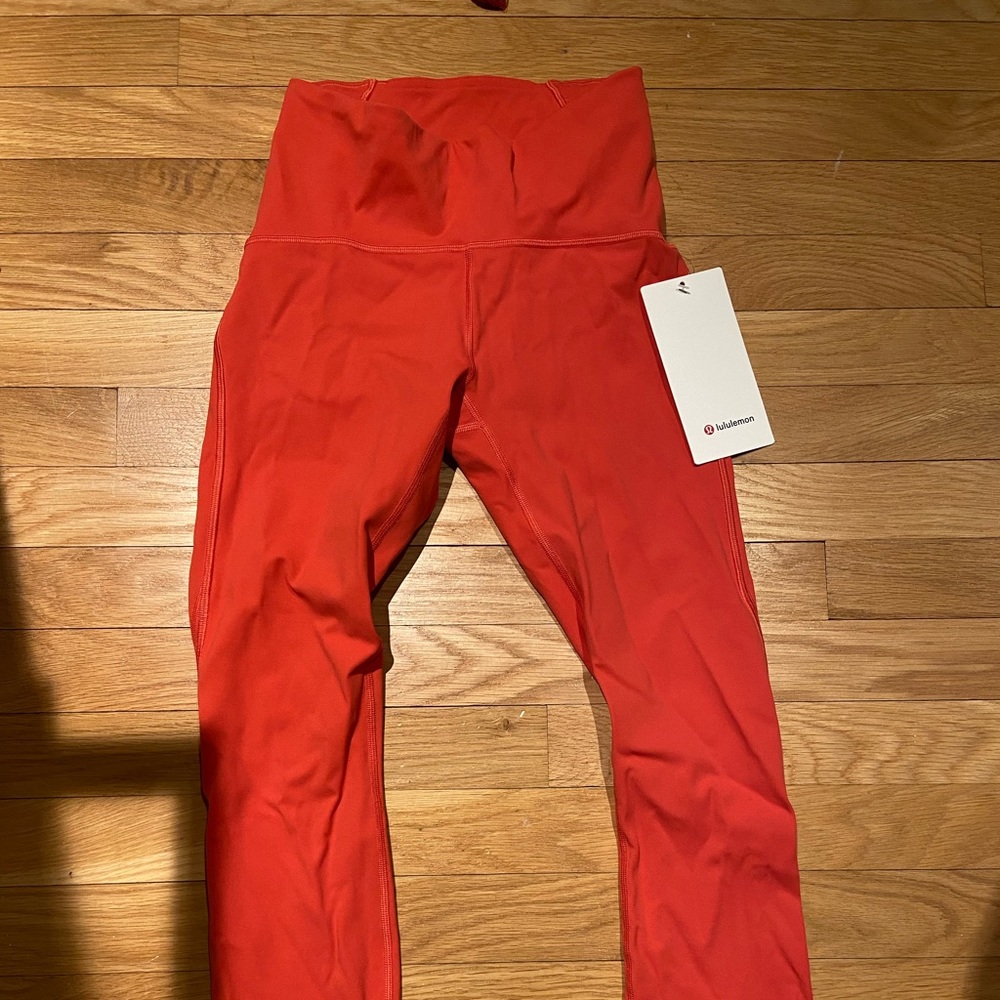 Train times HR tights 25” poppy coral color